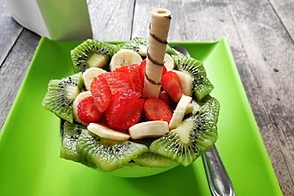 Acai bowl topped with fresh fruit and granola, the signature dish at Island Vintage Coffee.